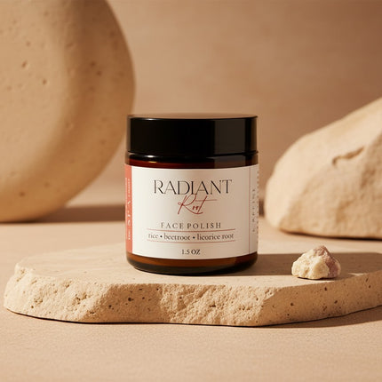 Jar of Radiant Face Polish on a stone surface with a neutral background