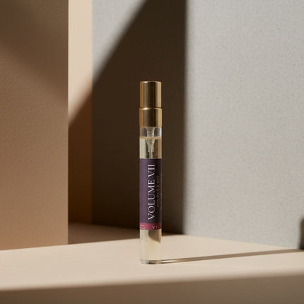 Volume III cologne bottle with gold cap on a neutral background